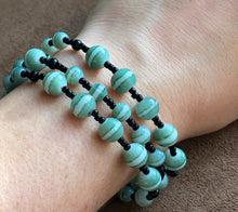 Load image into Gallery viewer, Multi-stranded black and green bracelet
