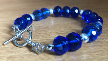 Load image into Gallery viewer, Faceted blue glass and silver bracelet
